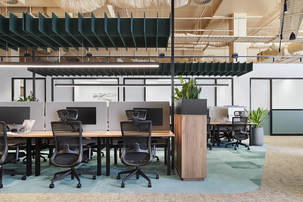 Winger Ergonomic Workspace Office Mesh Chair with Headrest in Black at Waterman Clayton Open Coworking Area