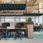 Winger Ergonomic Workspace Office Mesh Chair with Headrest in Black at Waterman Clayton Open Coworking Area