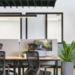 Winger Ergonomic Workspace Office Mesh Chair with Headrest in Black at Waterman Clayton Open Coworking Area
