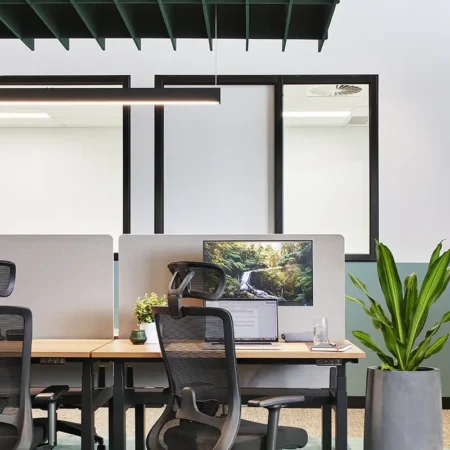 Winger Ergonomic Workspace Office Mesh Chair with Headrest in Black at Waterman Clayton Open Coworking Area