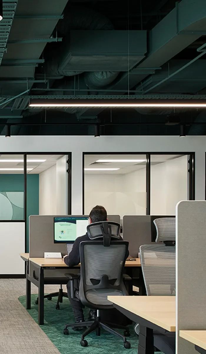 Black Winger Ergonomic Posture Mesh Office Task Chair in an Office at Waterman Clayton Coworking Centre