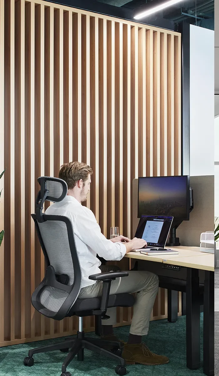 Grey and Black Winger Ergonomic Office Mesh Task Chair with Headrest-in-an-Office-at-Waterman-Blackburn North-Coworking-Centre